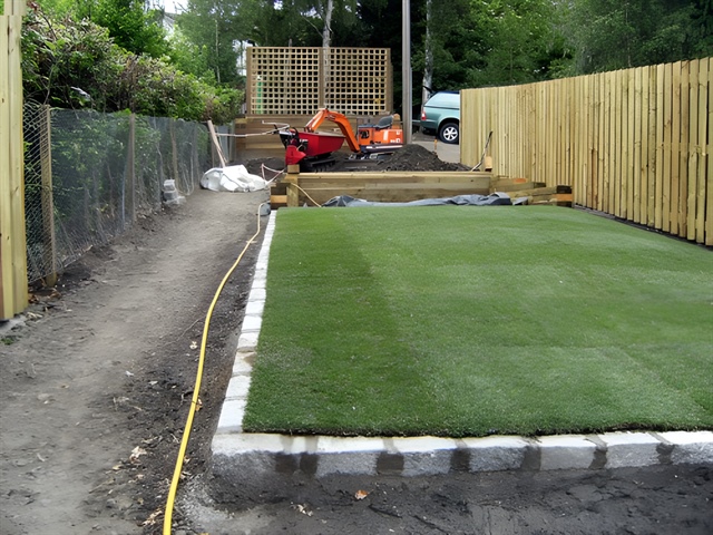 Lawn area prepared, edged and turf installed